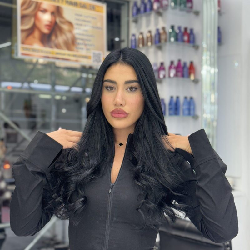 Long straight jet-black hair with keratin bond extensions