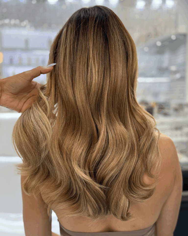 Warm caramel balayage waves by Goya
