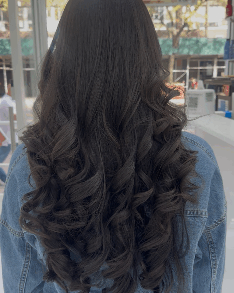 Long dark curled blowout by Lydia