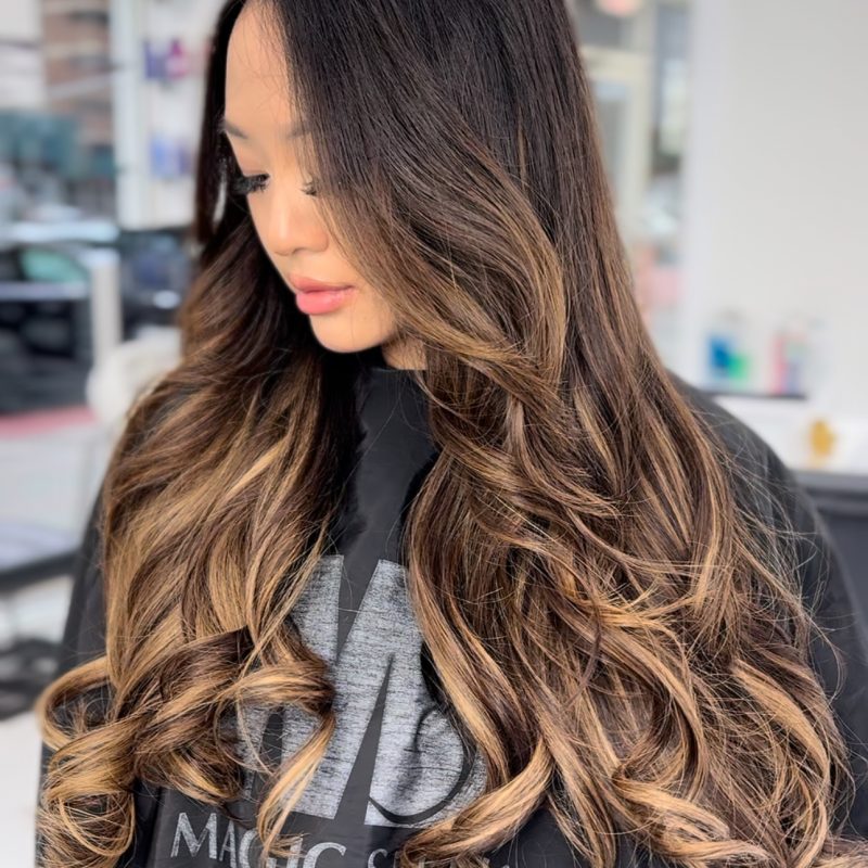 Long dark hair with caramel balayage and beaded I-tip extensions