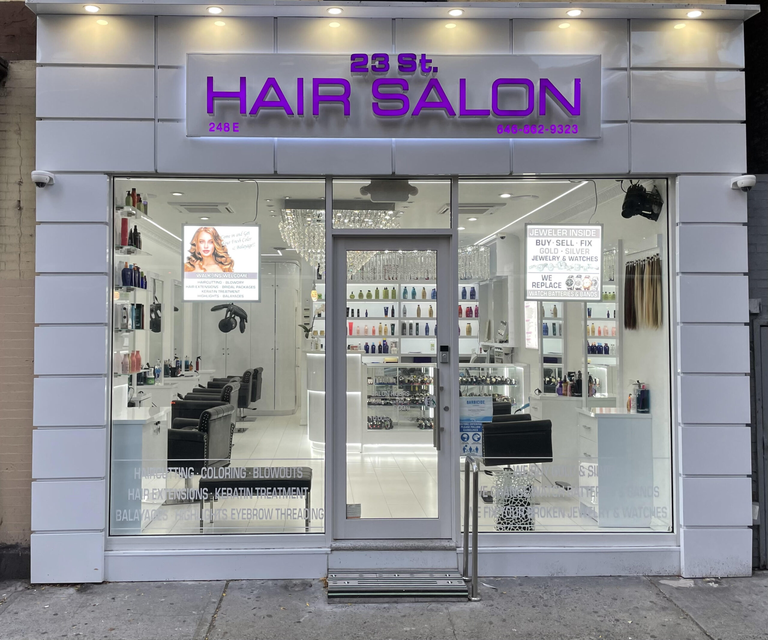 Exterior of 23rd Street Hair Salon at 248 E 23rd Street with purple signage