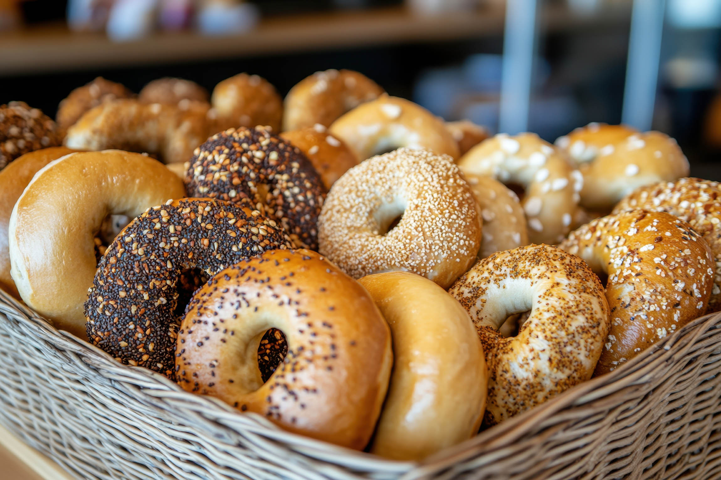 Wicker basket filled with a variety of assorted bagels