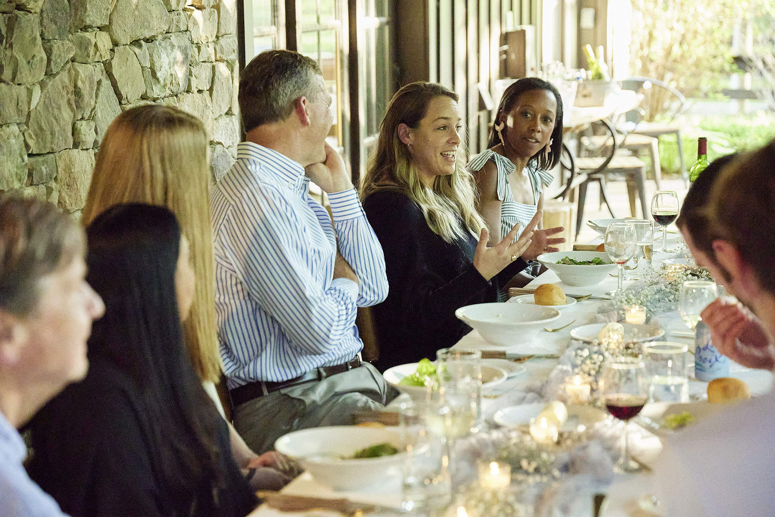 Academy Within participants in conversation at an in-person welcome dinner
