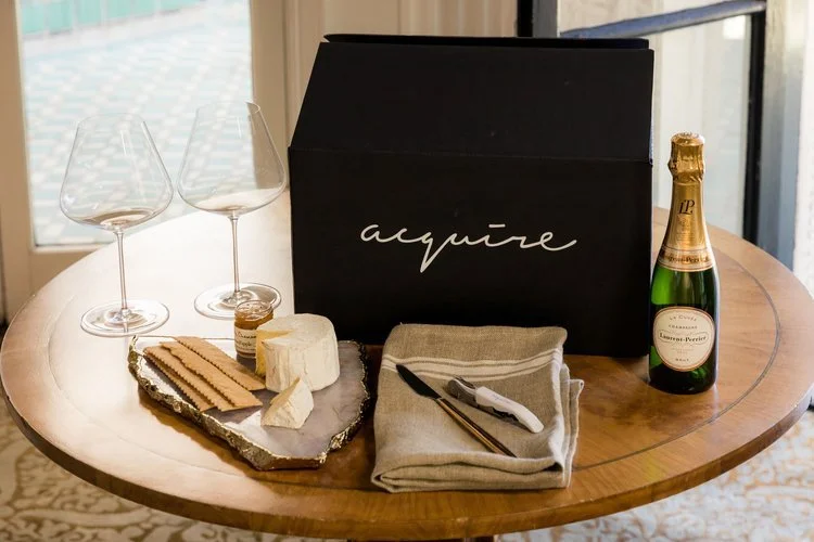 Acquire branded black gift box with wine glasses, champagne and a cheese board