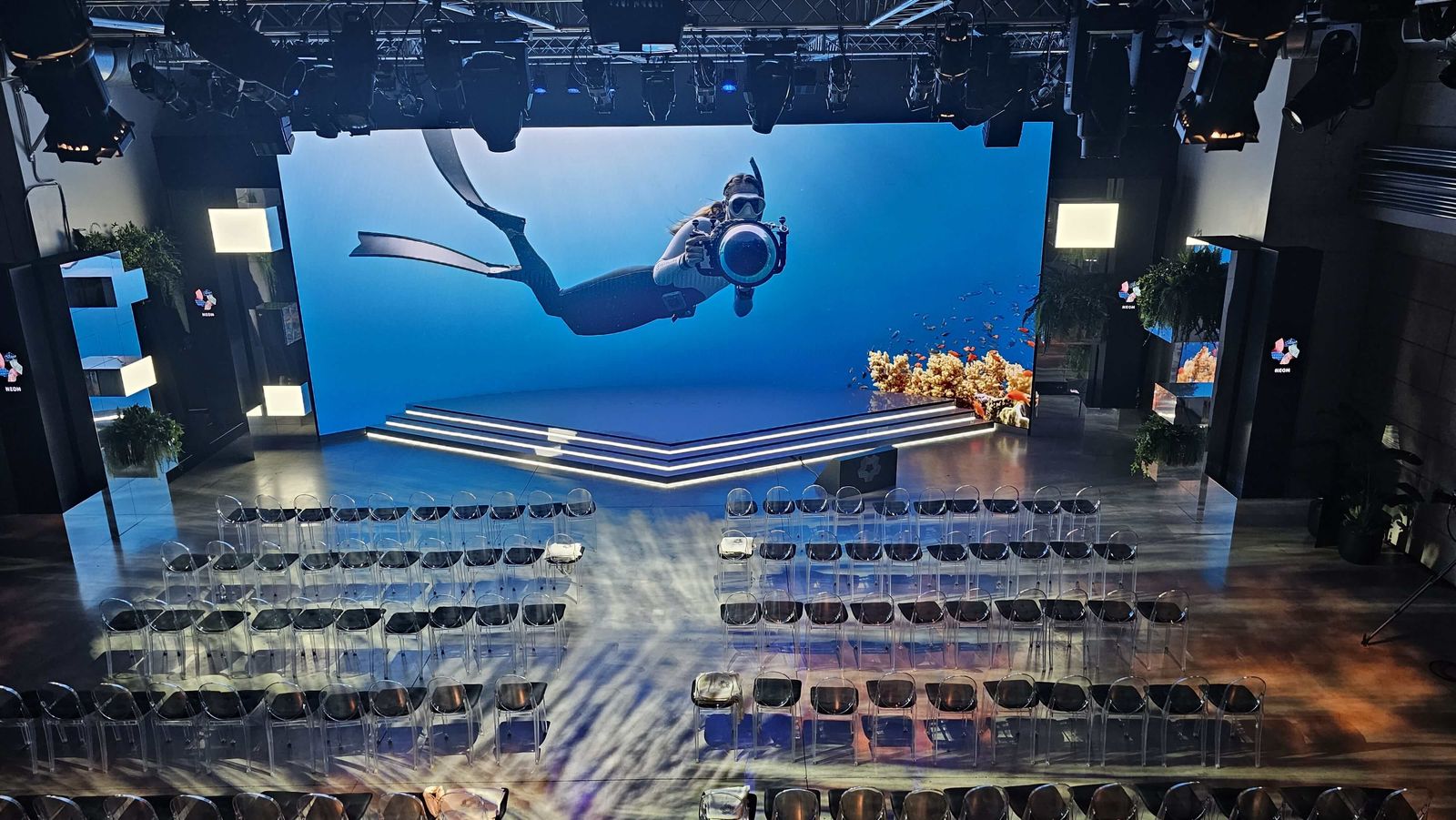 Full-scale event production: giant LED wall and audience seating