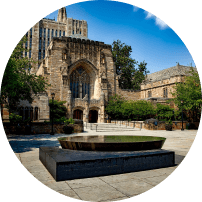 Gothic university building with a courtyard fountain