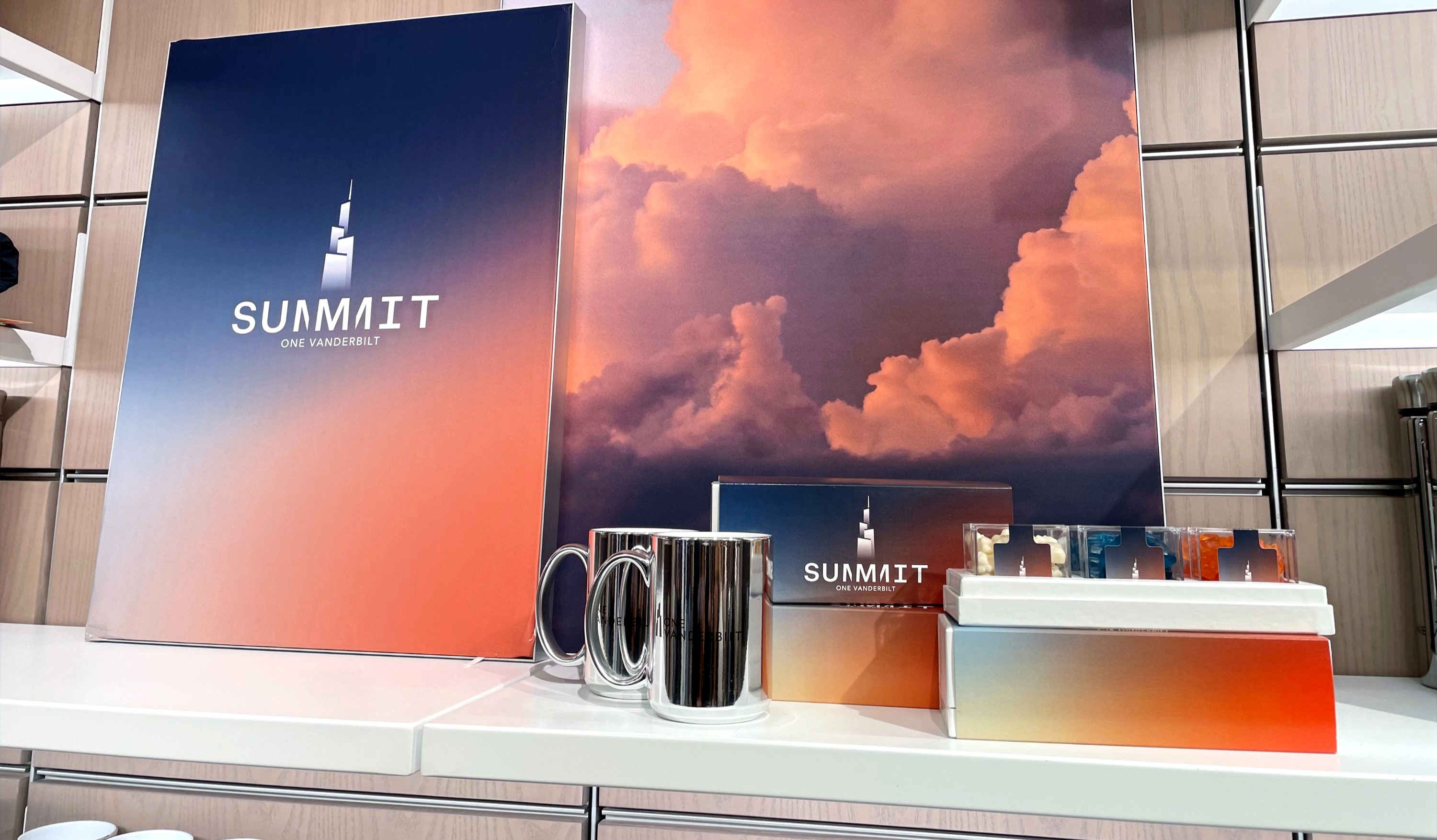 Summit One Vanderbilt branded merchandise display with mugs and gift boxes