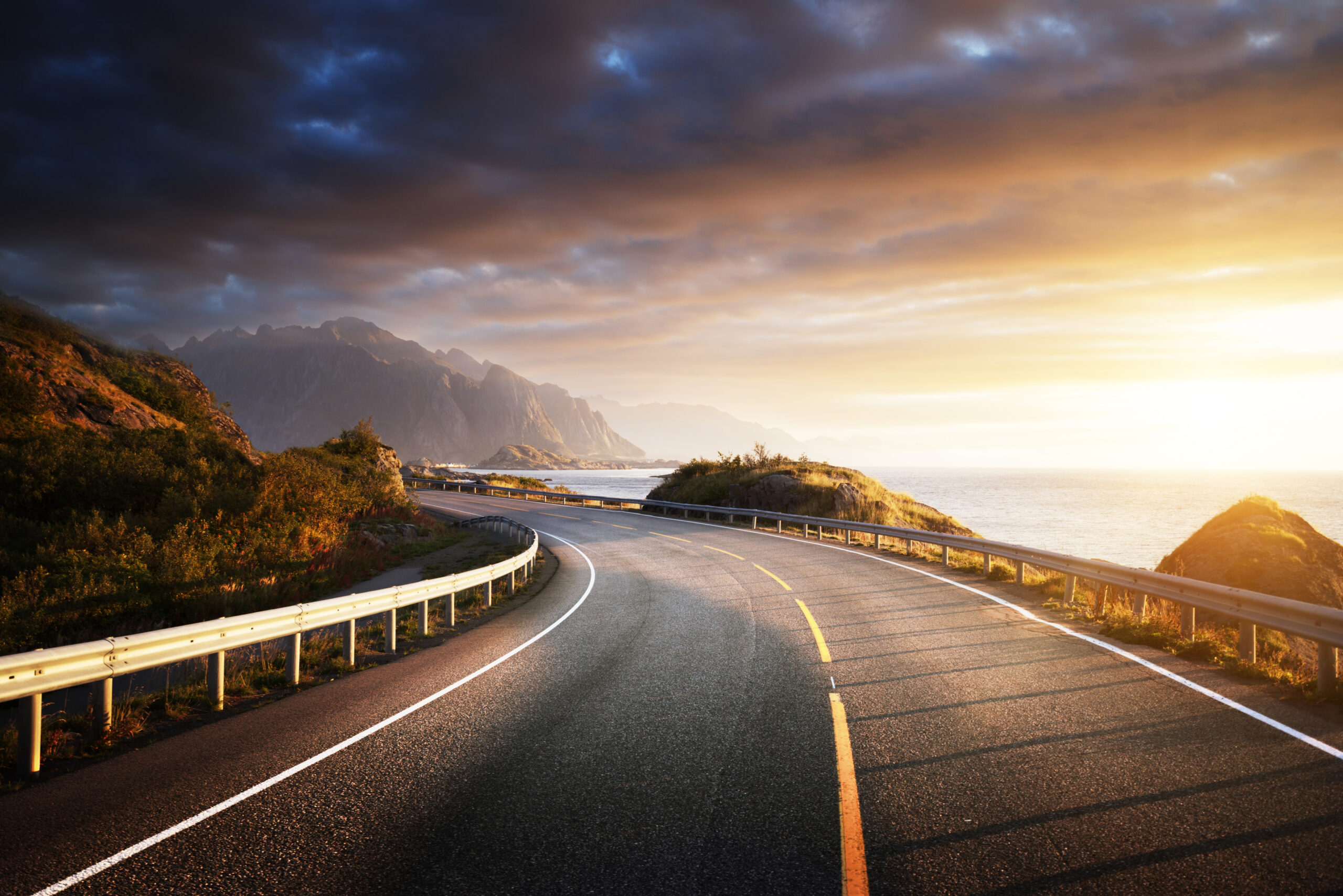 Winding coastal highway at sunset — the journey into your next season
