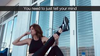 Andrea Marcellus exercising on a balcony