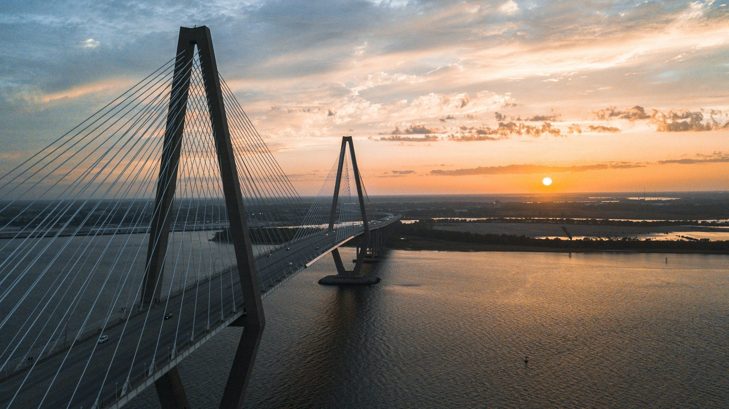 Arthur Ravenel Jr. Bridge at sunset over the river in Charleston, South Carolina
