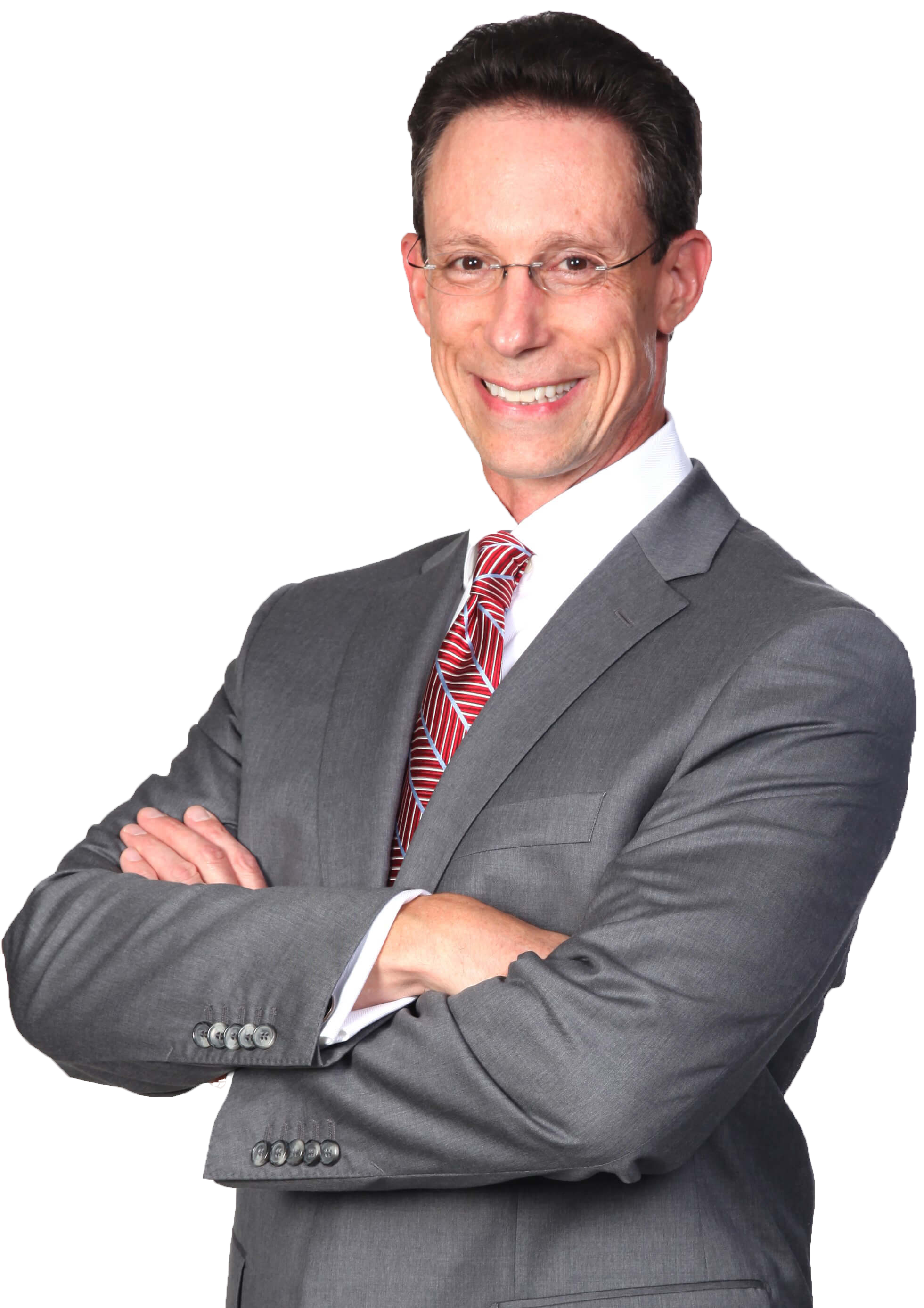 Edwards Holliday in a grey suit with a red tie, arms crossed