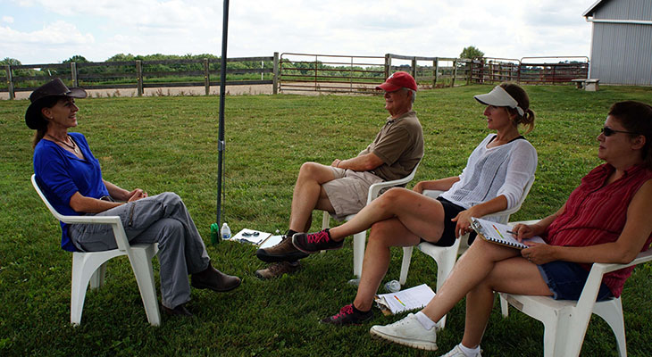 Outdoor debrief circle at a farm