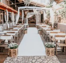 Outdoor wedding aisle with white runner