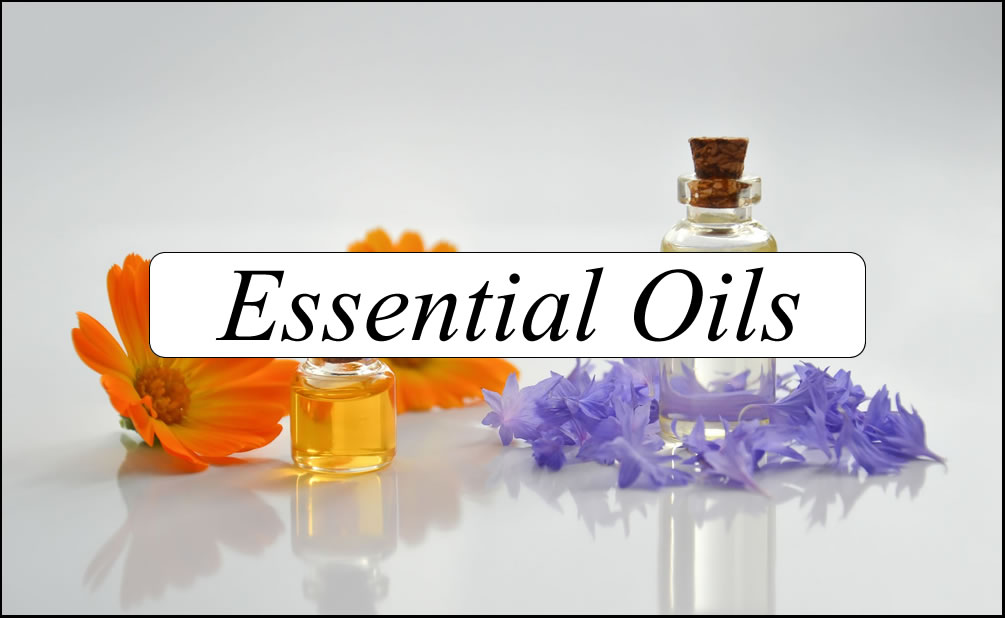 Marigold, amber oil bottle and purple flowers — Essential Oils