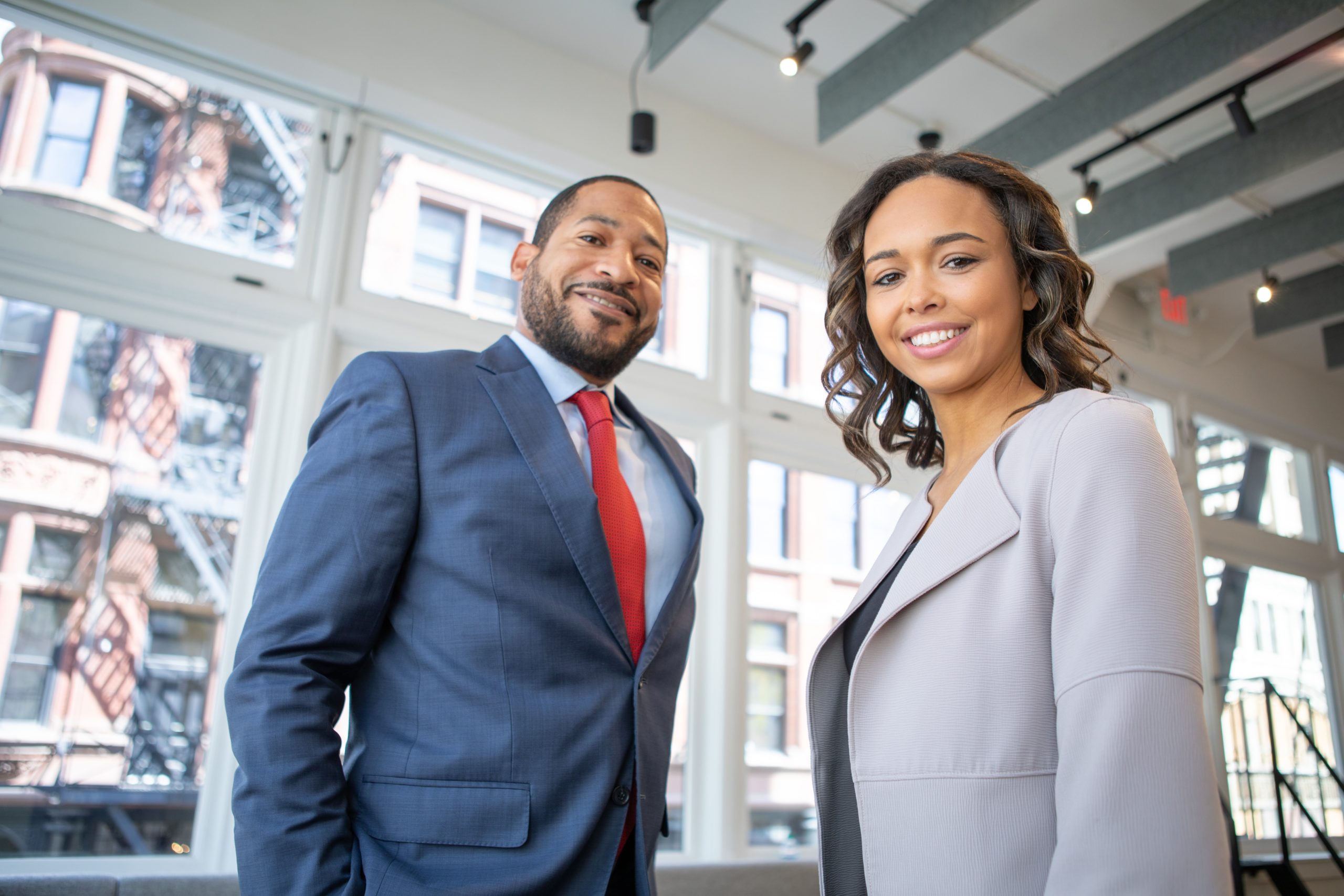 Two business professionals meeting in a bright loft office