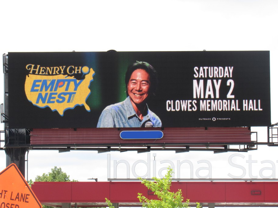 Henry Cho 'Empty Nest Tour' highway billboard, Indianapolis, wider shot