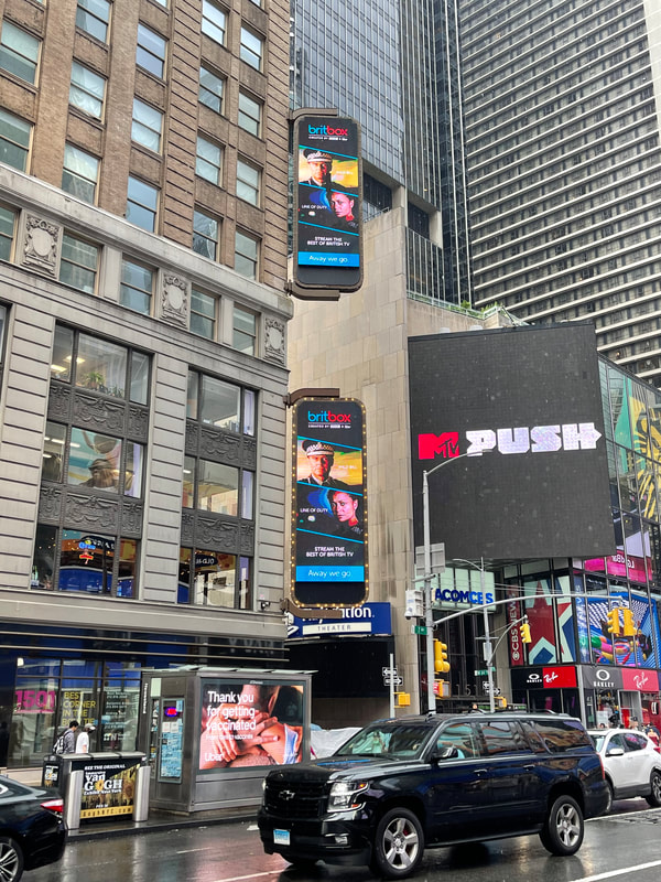 BritBox 'Line of Duty' vertical pole digital screens on Times Square building facade