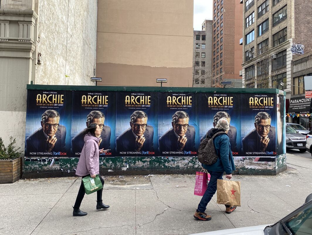 BritBox 'Archie: The Man Who Became Cary Grant' wallscape posters on NYC utility box