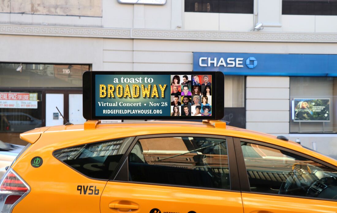 NYC yellow taxi with 'A Toast to Broadway' virtual concert ad on roof-top screen