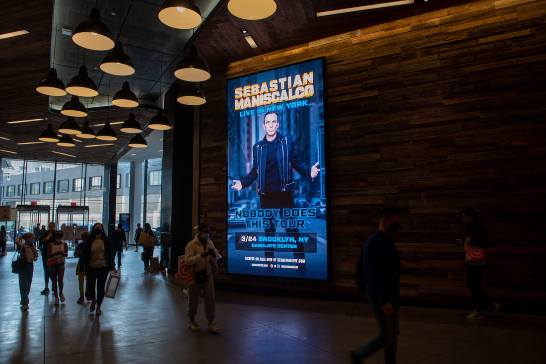 Sebastian Maniscalco 'Nobody Does This Tour' vertical digital screen in Brooklyn Center venue lobby
