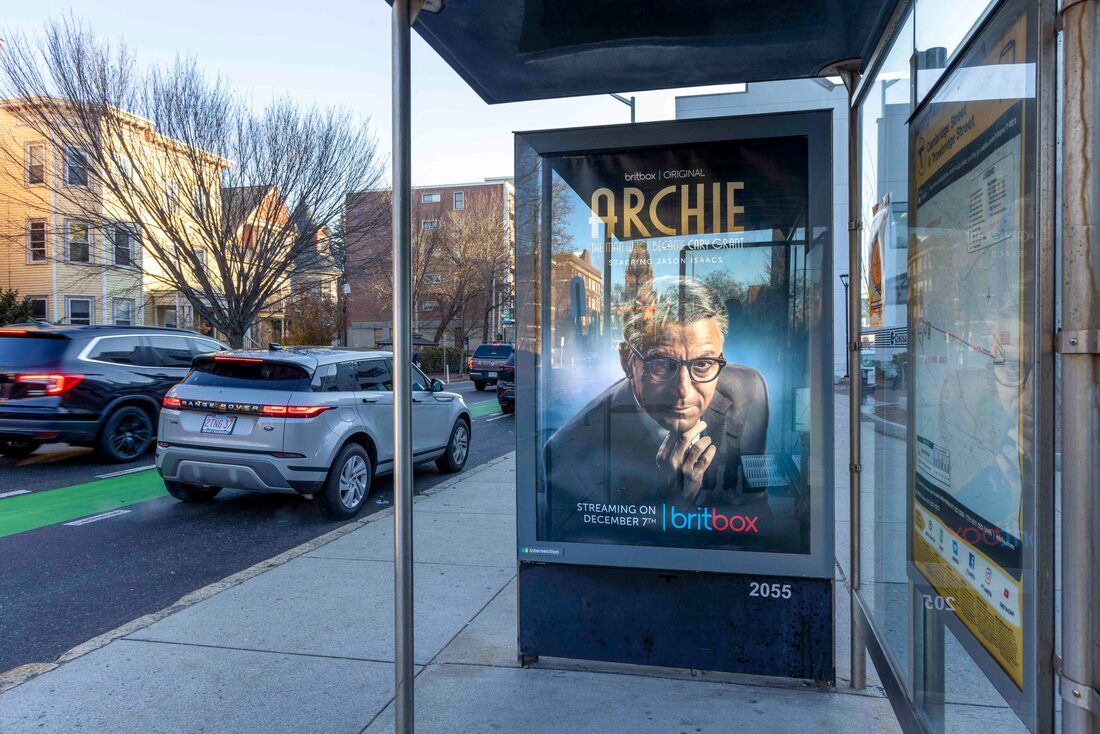 BritBox 'Archie' poster in a Boston bus shelter on the street