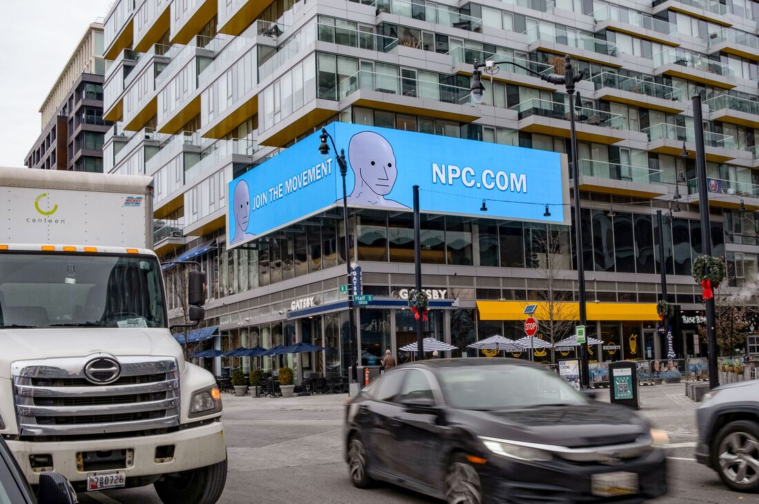NPC.com 'Join the Movement' blue digital billboard on a DC building exterior