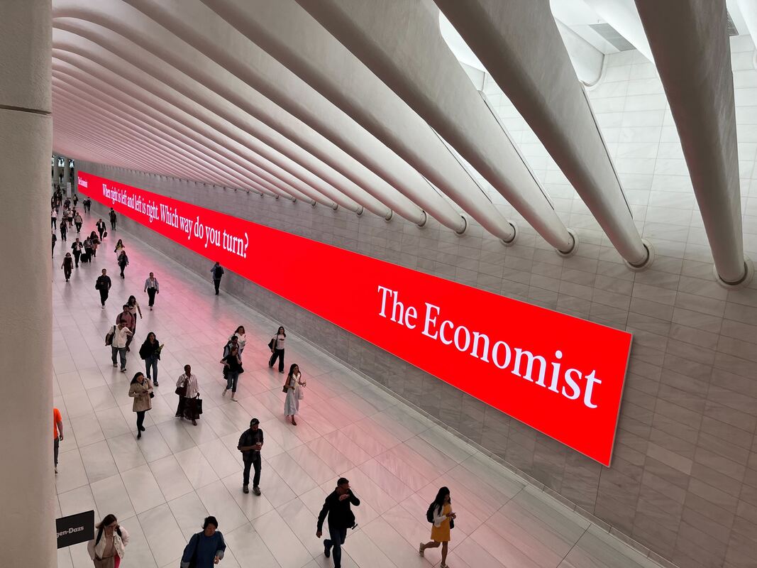 The Economist long red digital wall screen inside World Trade Center Oculus corridor