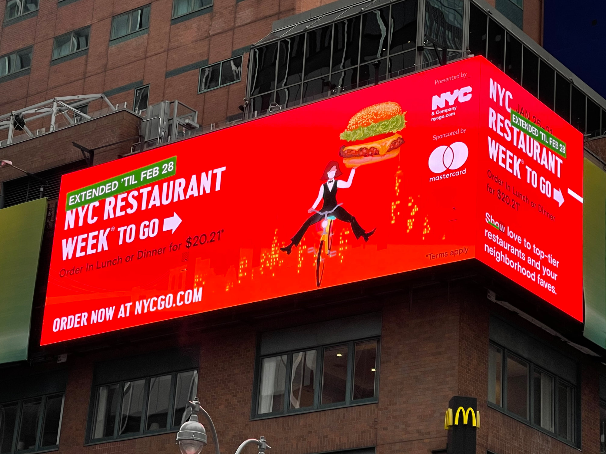 NYC Restaurant Week 'To Go' digital billboard on building exterior, Times Square area