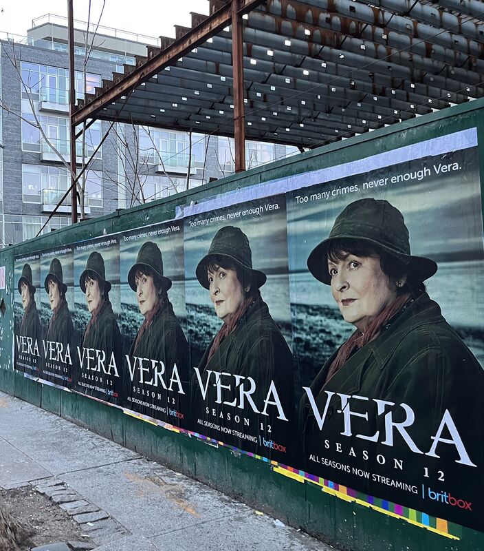 BritBox 'Vera Season 12' repeated wall posters on construction hoarding, NYC