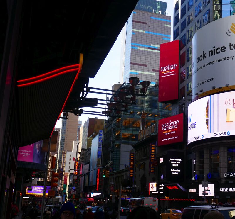 Times Square 42nd Street buildings with 'A Discovery of Witches' vertical digital screens