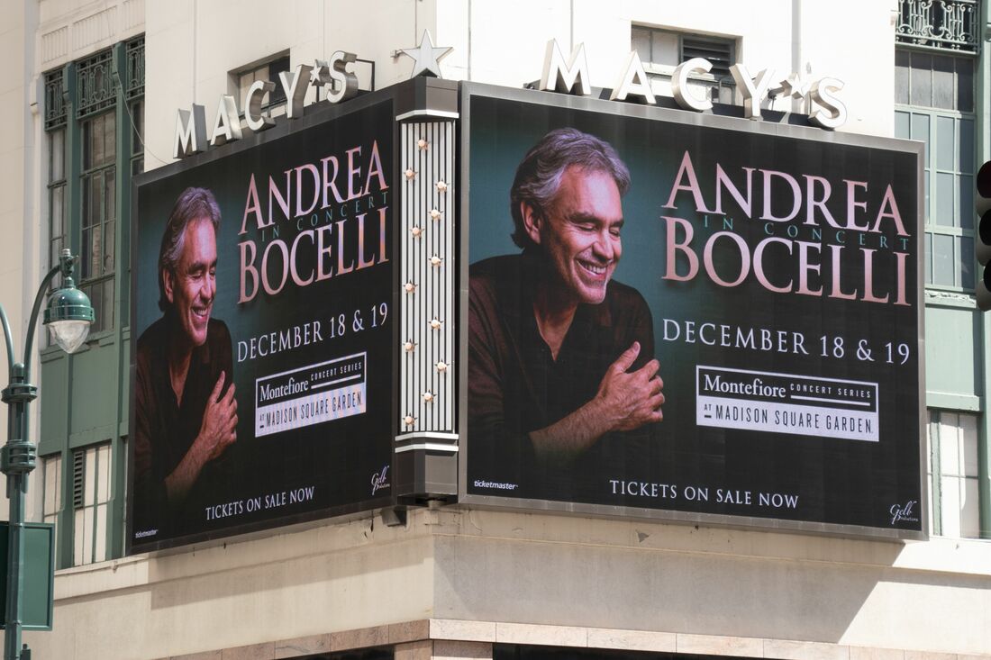 Andrea Bocelli In Concert billboard on Macy's building corner, Times Square