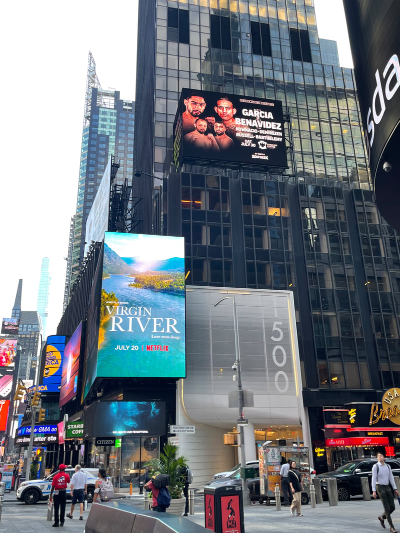Times Square tall building with Garcia vs Benavidez and Virgin River billboards stacked