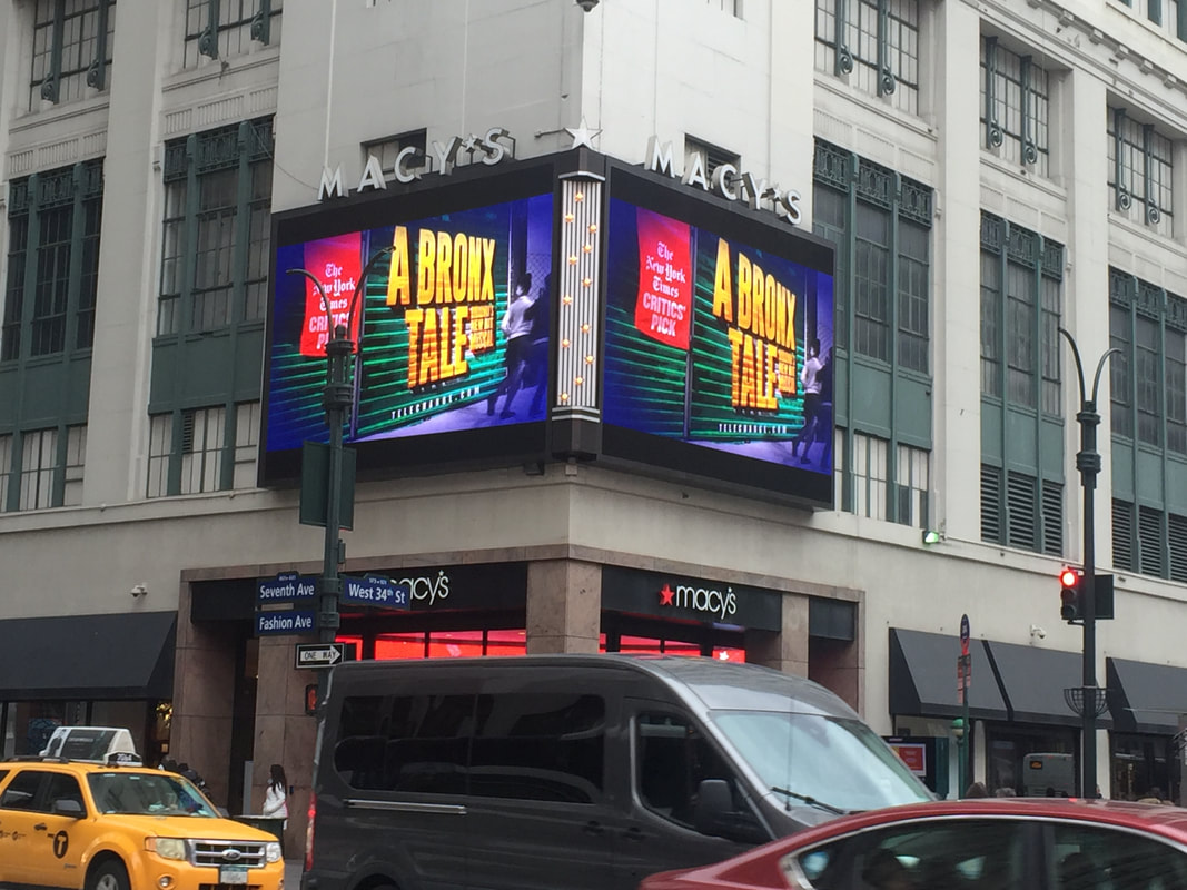 A Bronx Tale Broadway musical digital billboard wrapping Macy's building corner, 34th St NYC
