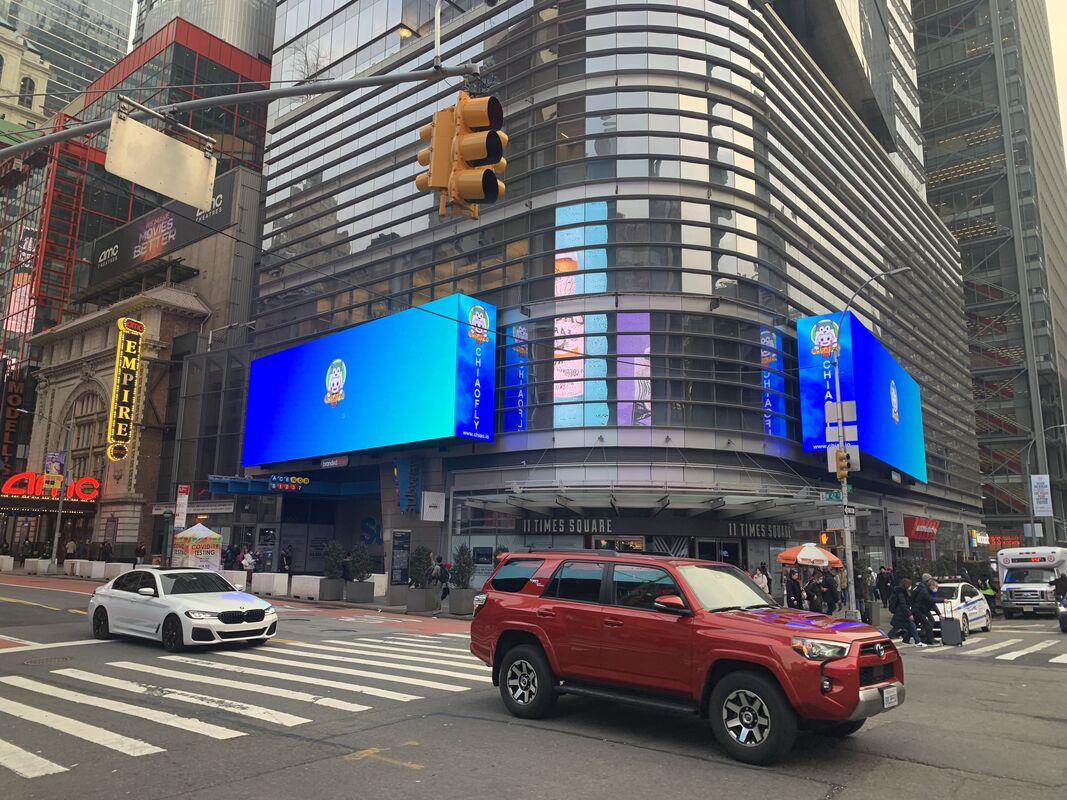 11 Times Square building exterior with ChiaoTzu Inu crypto NFT billboard on large LED screens