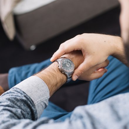 A man checking his wristwatch