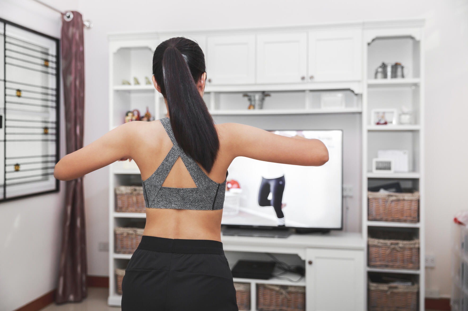 Woman doing aerobic exercise at home