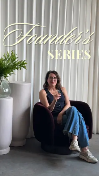 Founder's Series — woman seated in a dark velvet chair