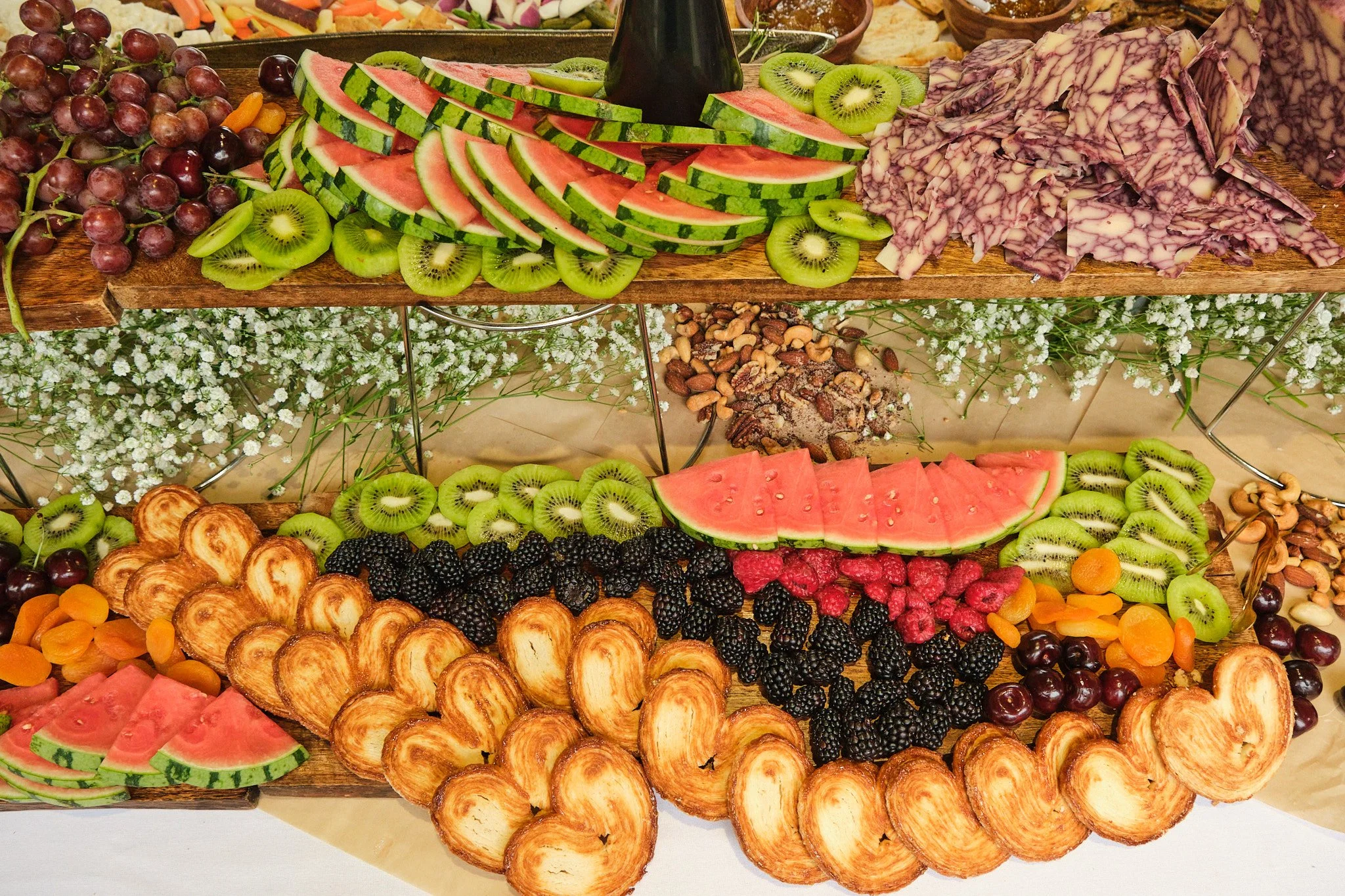 Two-tier fruit and pastry display board