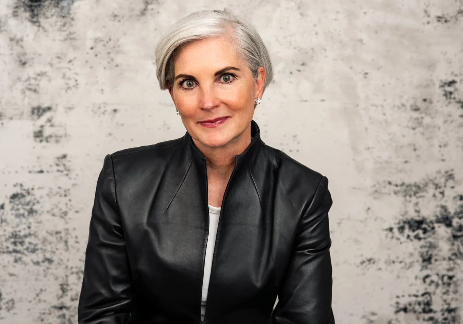 Christina Langdon in a black leather jacket, color portrait