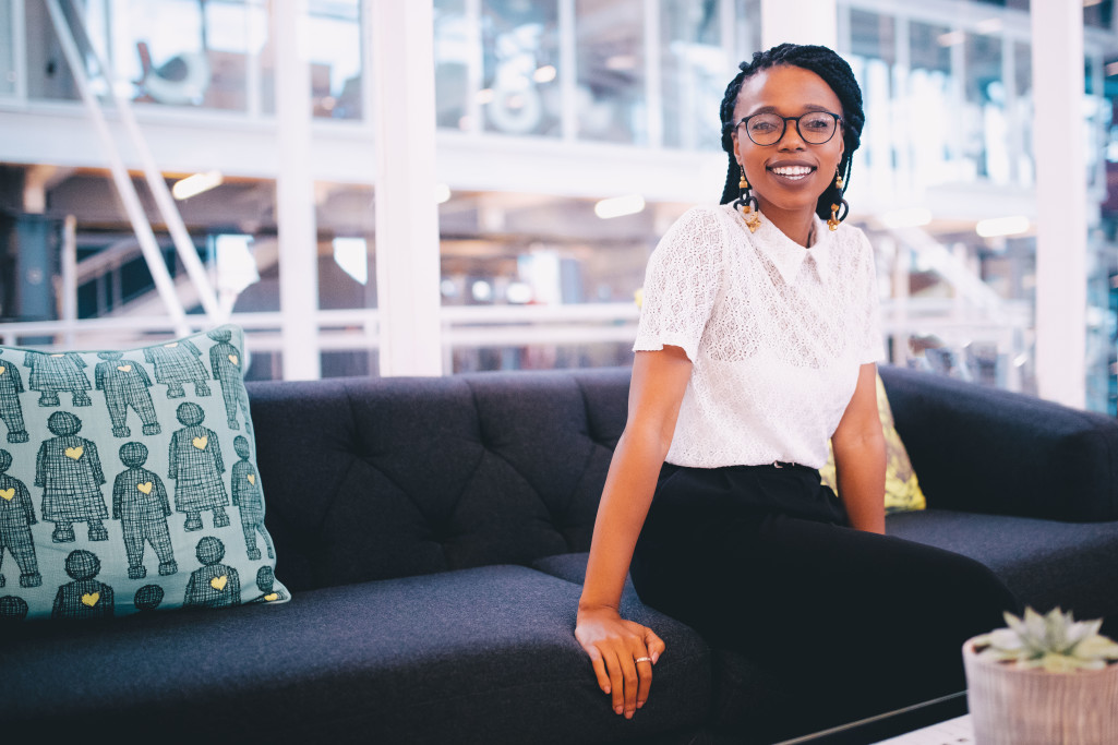 Smiling professional leader seated in a bright office