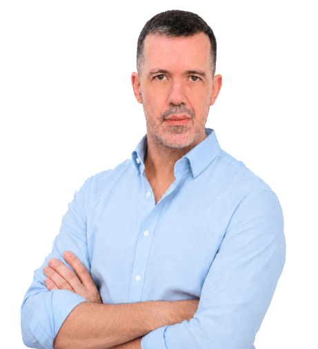 Pedro Pinto, arms crossed, in a light blue shirt