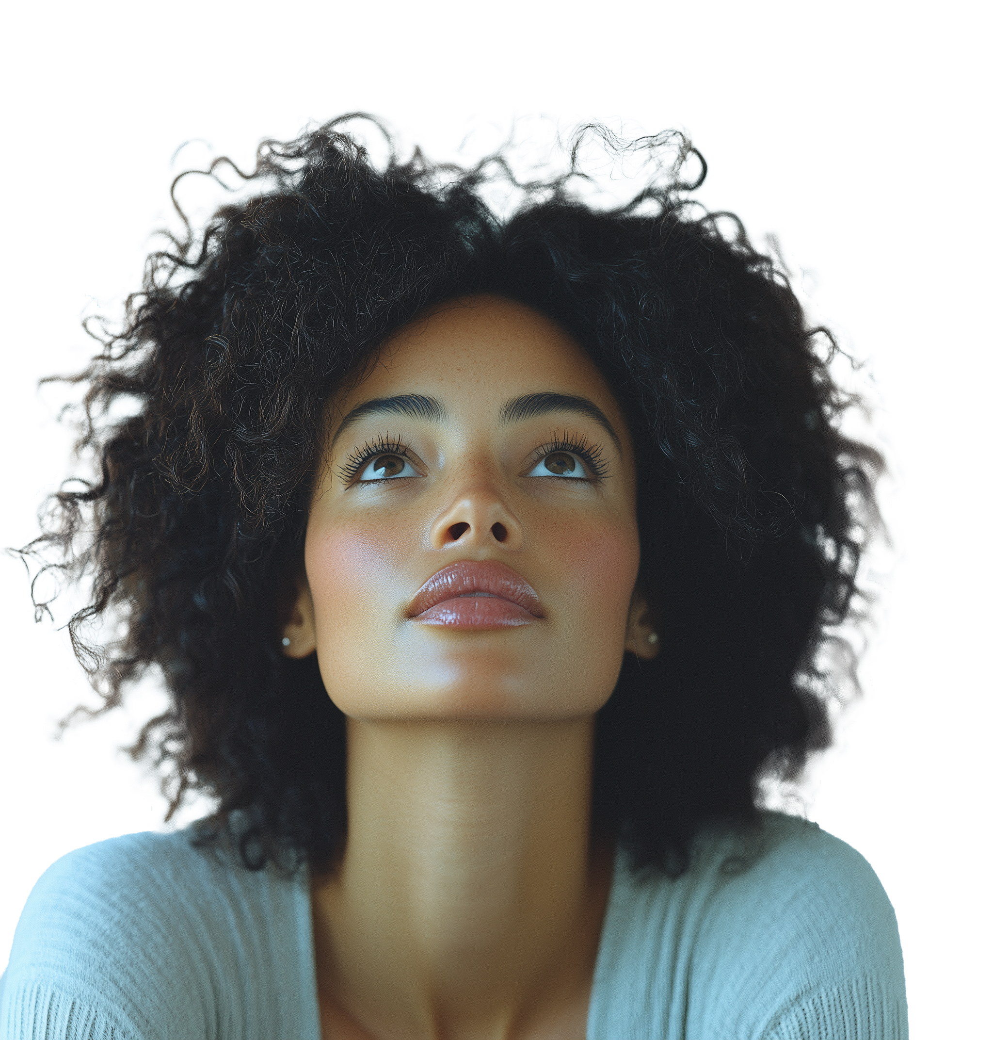 Young woman looking upward, hopeful