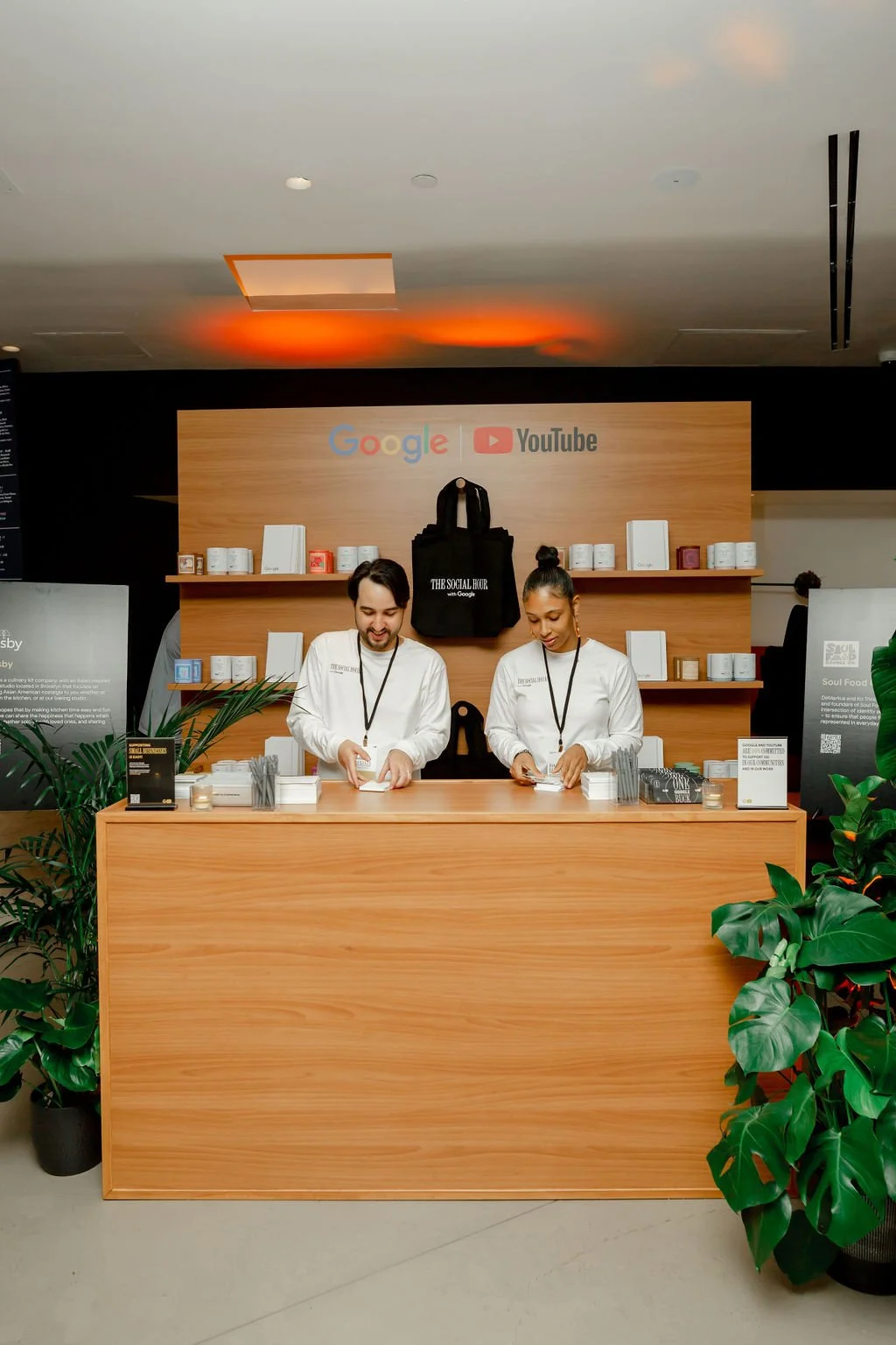 Staff behind a counter at a Google YouTube event reception desk
