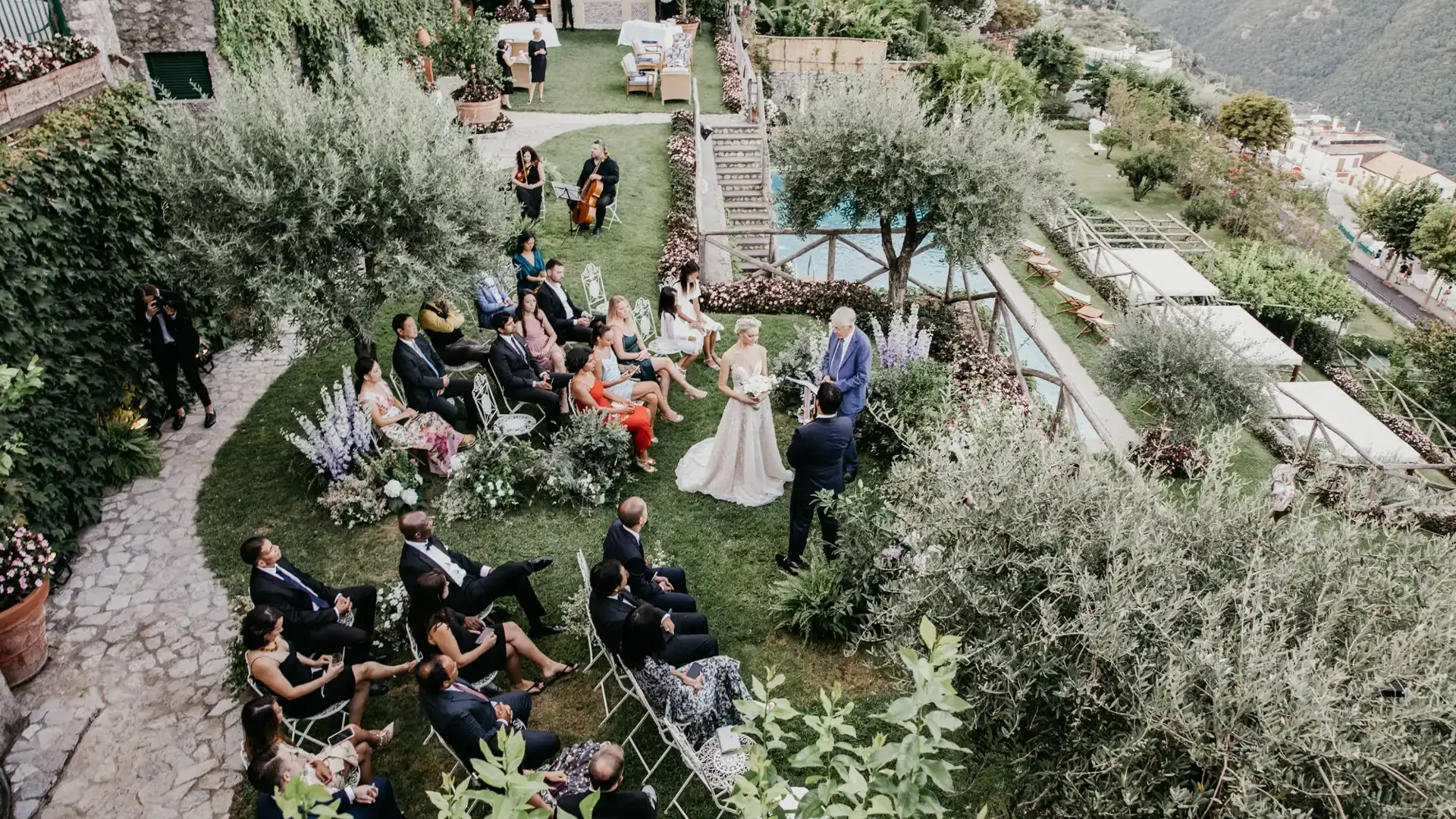 Aerial view of an Italian garden wedding ceremony on a terraced hillside
