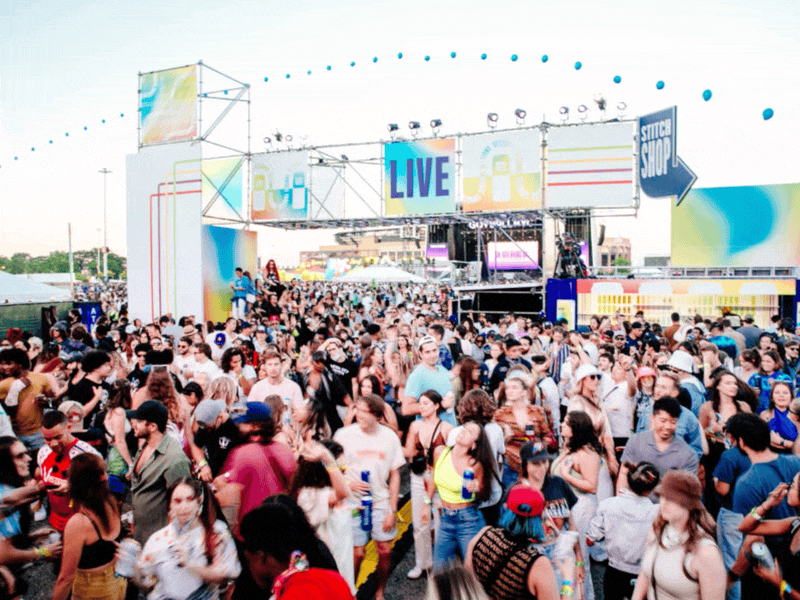 Festival crowd in front of a branded LIVE stage at a Diamond Street production