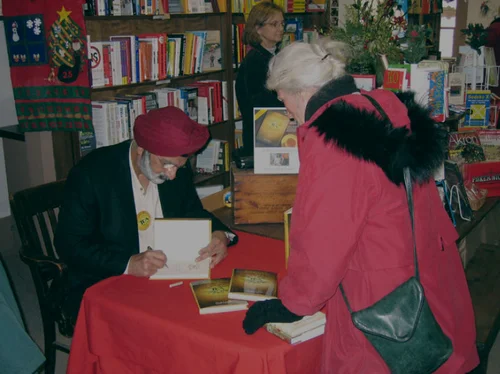 Ratanjit S. Sondhe signing a book at a bookstore table