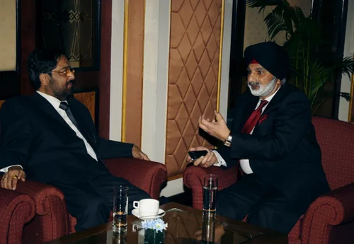 Ratanjit S. Sondhe in a one-on-one consulting meeting in a hotel lounge