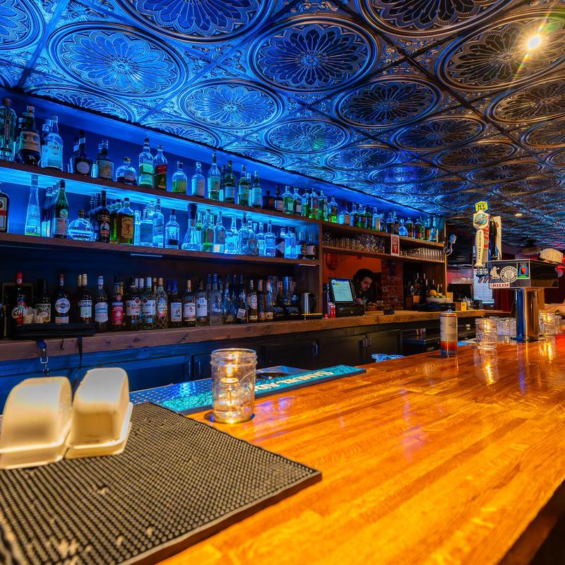 Cocktails under the pressed-tin ceiling at Juke Bar NYC