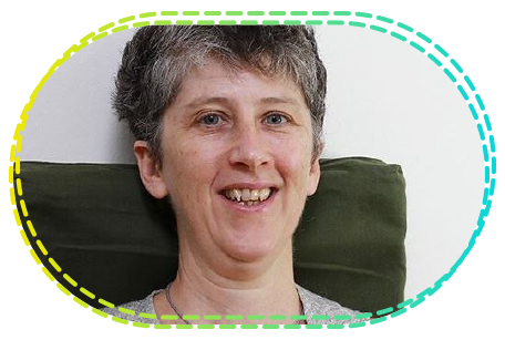 Close-up portrait of Clare Maxwell smiling, framed in a dashed oval border