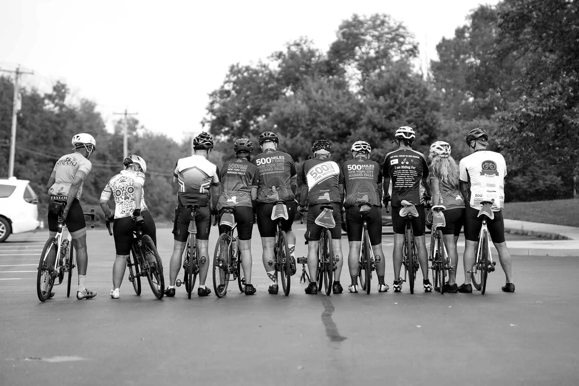 Row of cyclists seen from behind in Empire State Ride jerseys